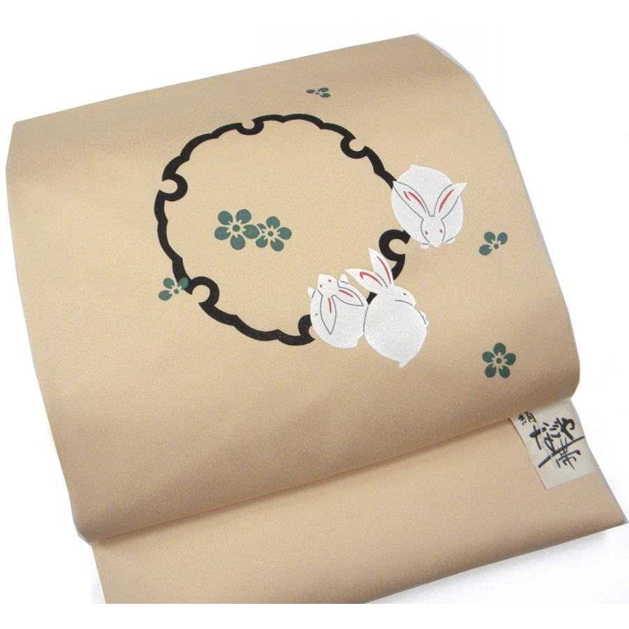 名古屋帯 正絹染帯 砥粉色雪輪にうさぎ柄 変り織生地 仕立て上がり 染