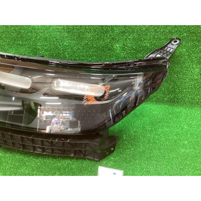 フリード 6AA-GT7 左ヘッドランプASSY E:HEVエアー EX 4WD NH830Mの画像
