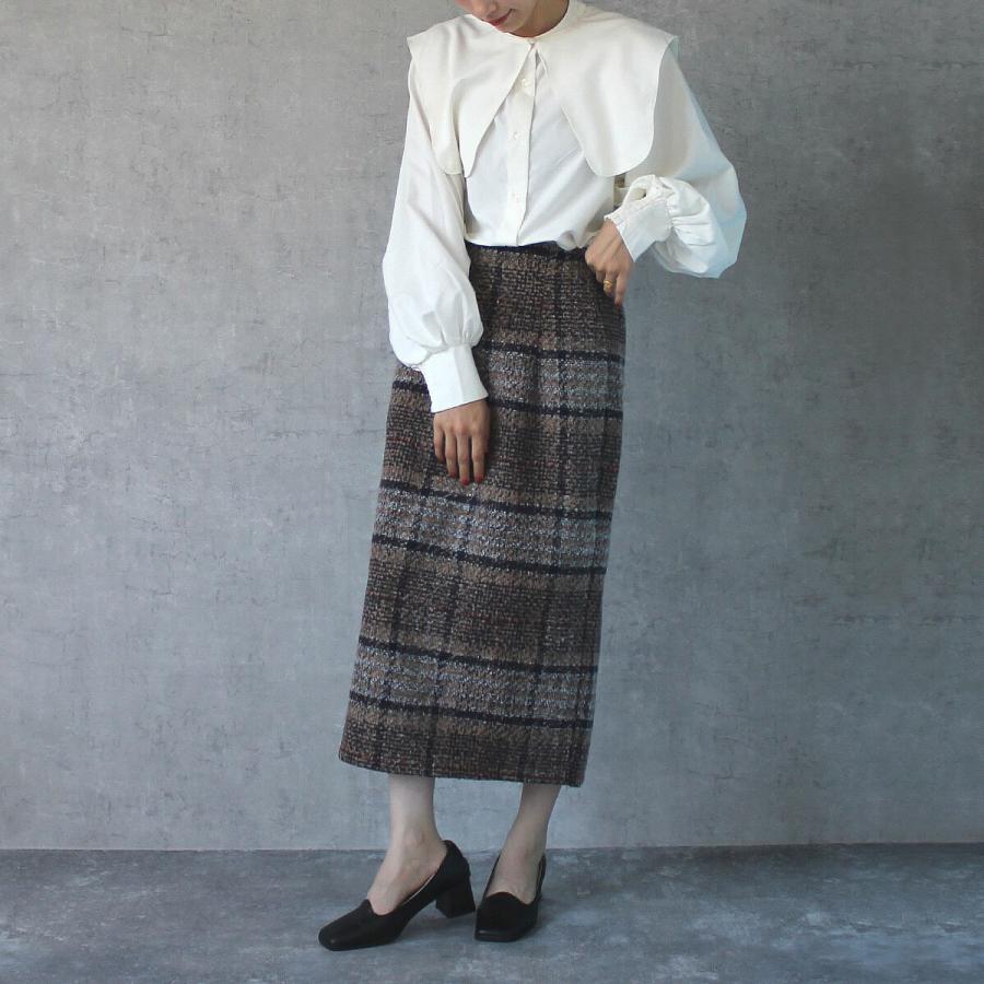 落ち着いたトーンにポイントカラーがあしらわれたリングチェックタイトスカート |  | 05