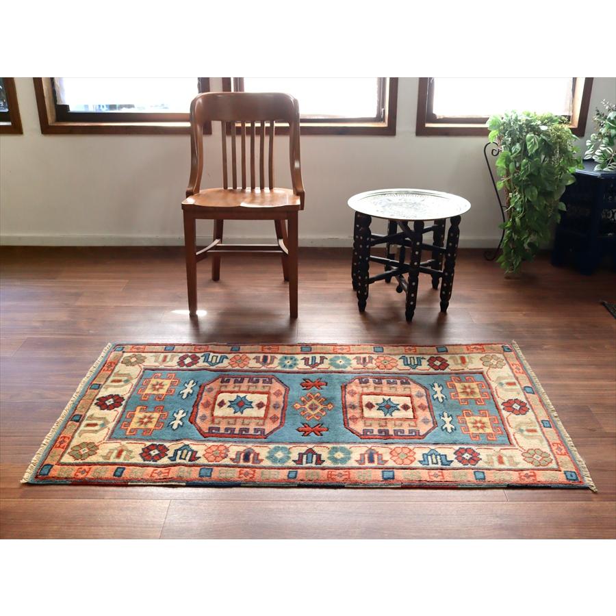 トルコの手織り絨毯 チャナッカレ 148x82cm 幾何学モチーフと小花 |  | 01