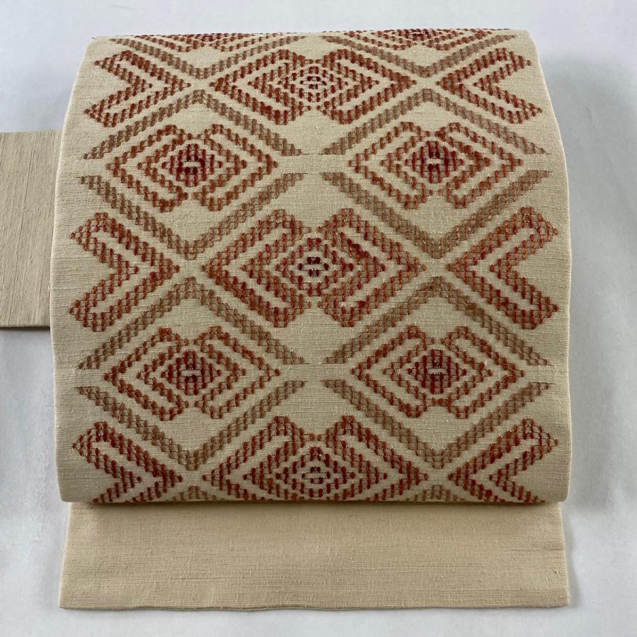 名古屋帯 美品 逸品 塩辛 紬地 花唐草 幾何学模様 絞り ベージュ 正絹 【
