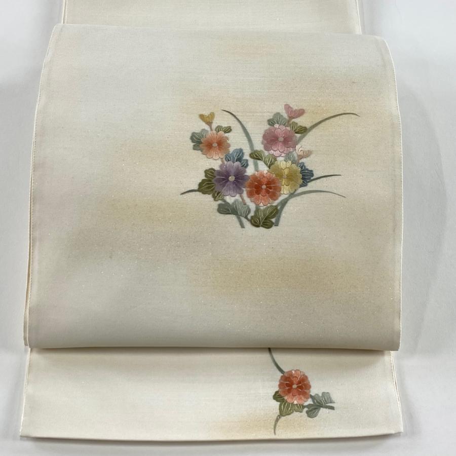 値引き。全通袋帯。友禅たたき染め。お太鼓のタレにワンポイントの刺繍