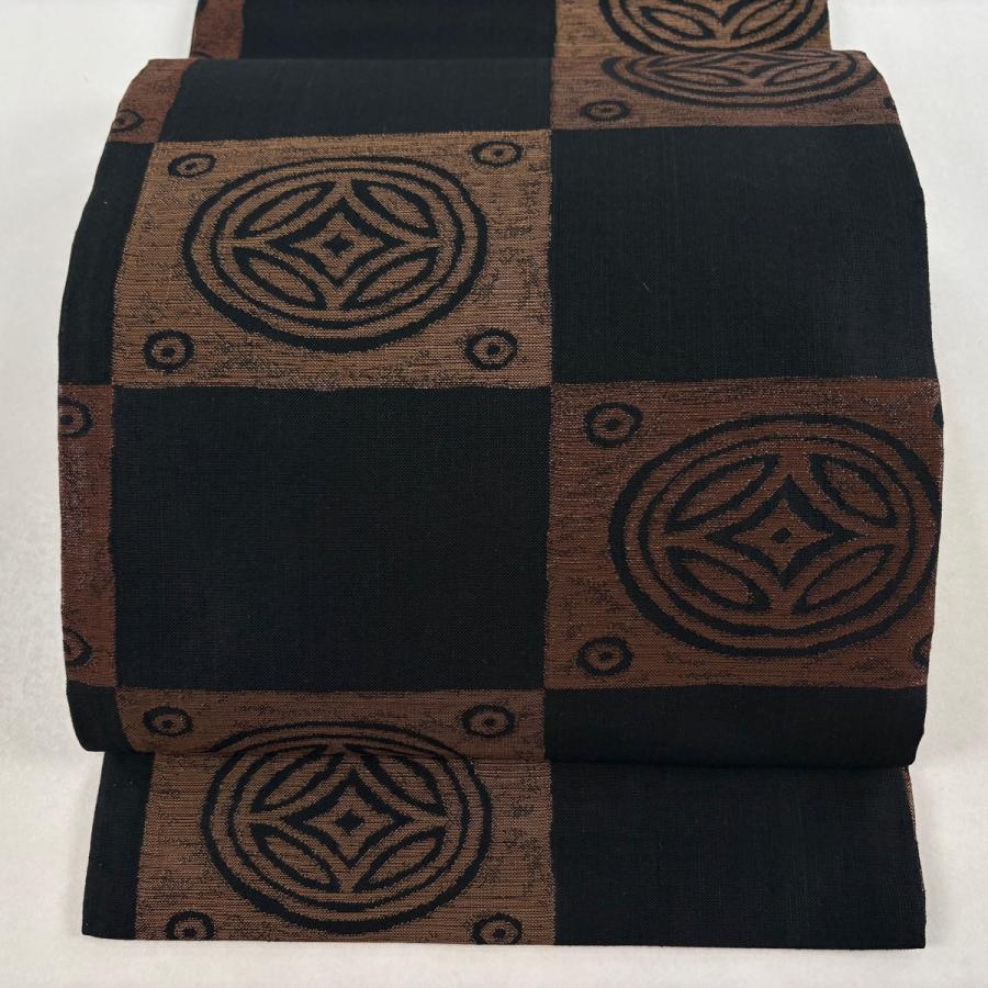 紬の名古屋帯 手織り 未使用品 逸品！ 美品 開き名古屋帯 逸品 勝山織物 落款あり 紬地 市松 七宝 箔 黒 正絹