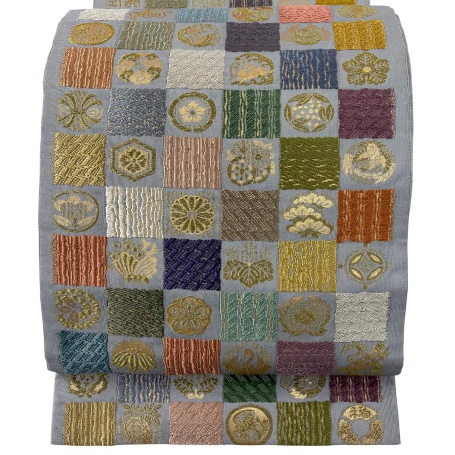 美品 袋帯 名品 草木染 つづれ織 紬地 変わり市松 鶴 唐織 箔 青灰色