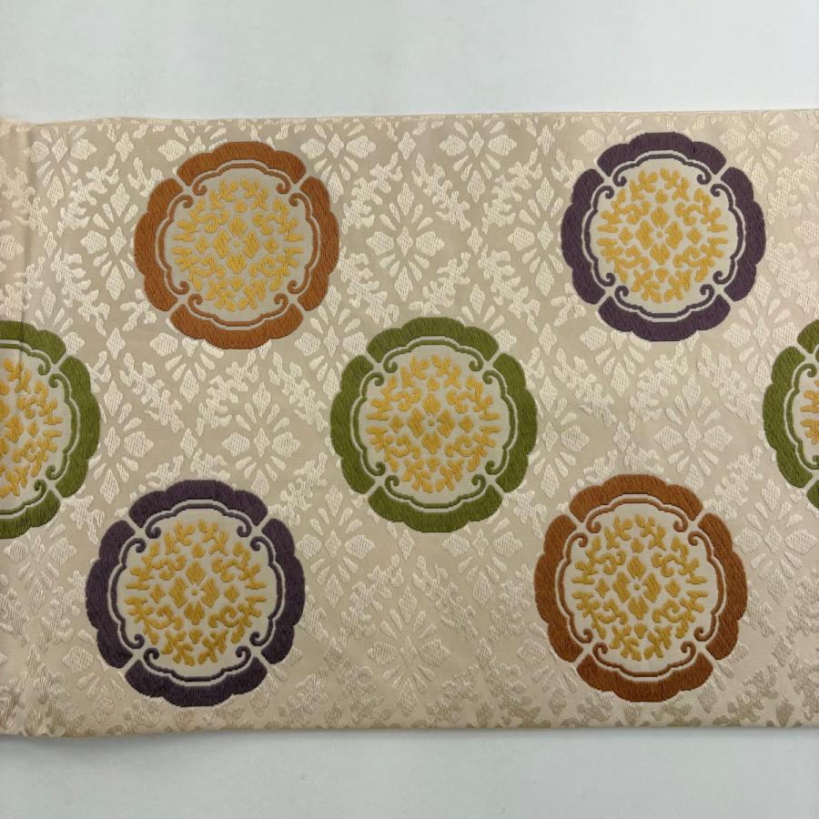 開き名古屋帯 逸品 人間国宝 喜多川平朗 華文 花菱 唐織 薄オレンジ 正絹 中古