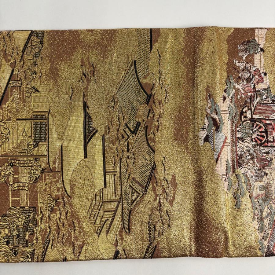 美品 丸帯 名品 建物 人物 箔 金糸 金色 お太鼓柄 正絹 中古 