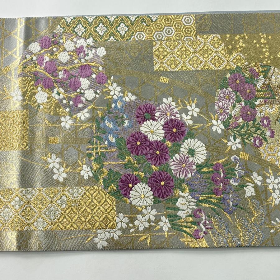 美品 袋帯 逸品 古代帝王紫 草花 有職文様 唐織 金糸 灰色 お太鼓柄