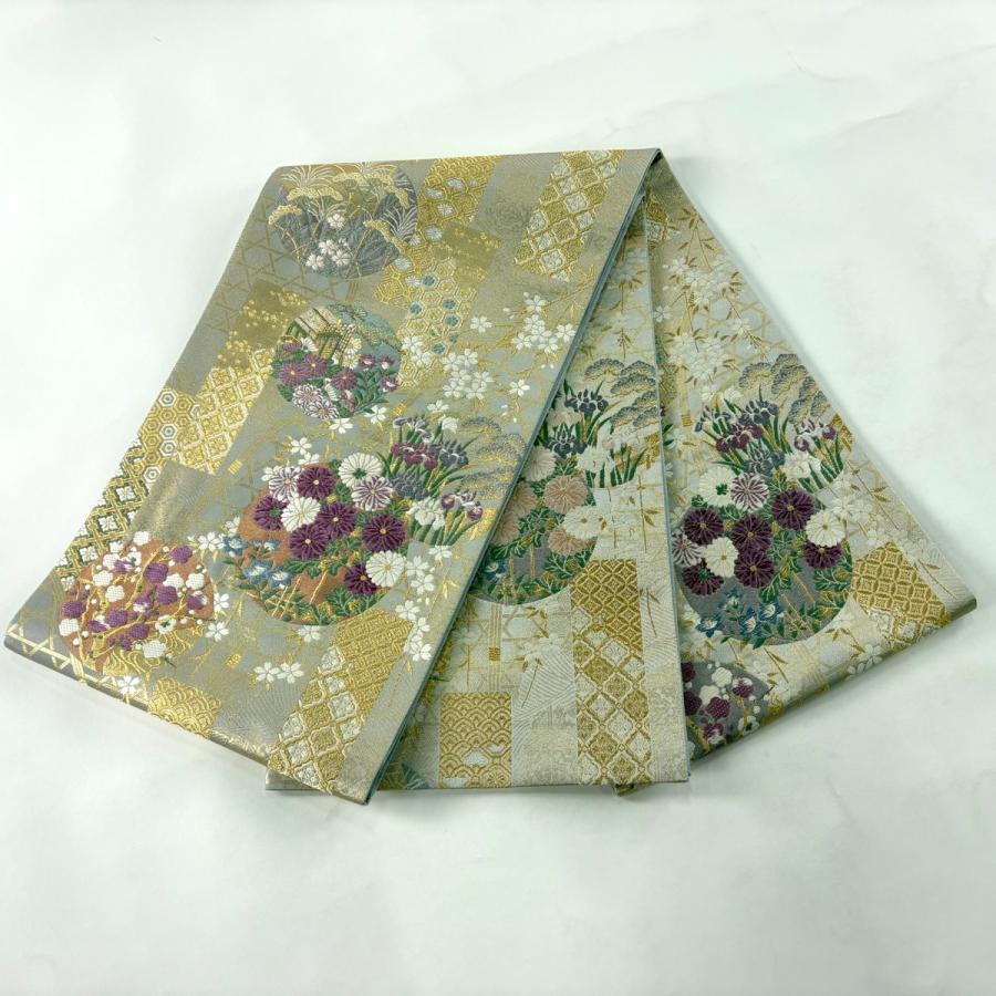 美品 袋帯 逸品 古代帝王紫 草花 有職文様 唐織 金糸 灰色 お太鼓柄