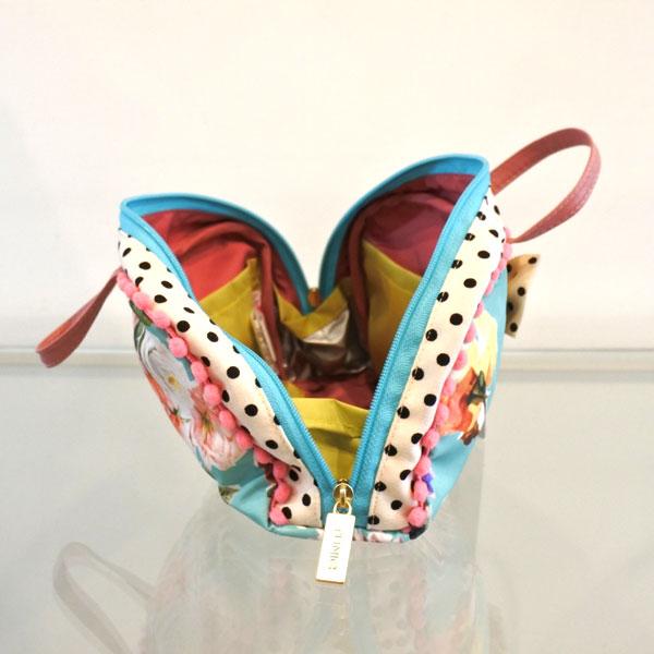 チュニック TUNIC チュニック ゴールドリボンのコスメポーチ