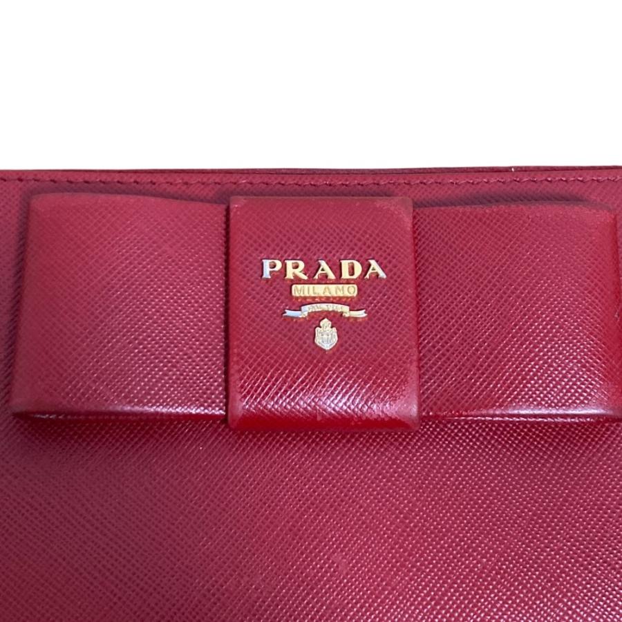 良品 PRADA プラダ サフィアーノレザー リボンモチーフ ラウンドファスナー ロングウォレット 長財布 レッド レディース 古着 中古 USED PRADA - 良品 PRADA プラダ サフィアーノレザー リボンモチーフ