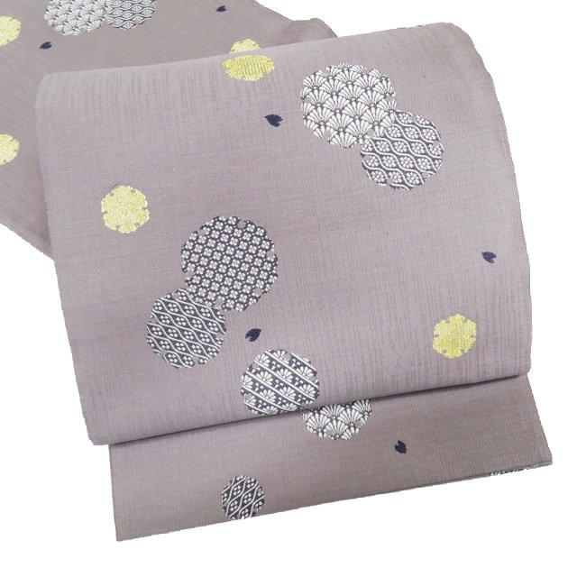 袋帯 未使用 正絹 カジュアル 仕立て上がり 六通 雪輪取り 桜散らし 暁  