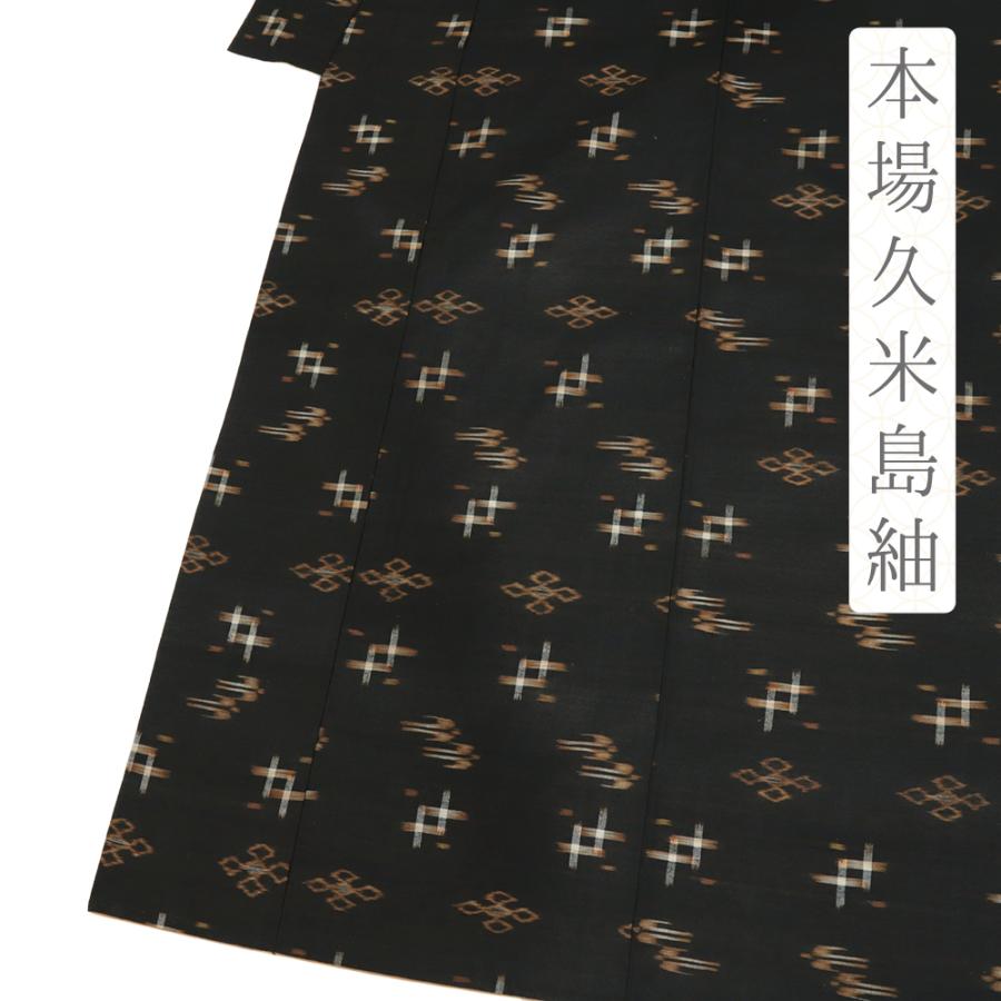 D385 本場久米島紬　絣紋様　正絹　着物　袷　しつけ糸付き未使用極美品 本場久米島紬 正絹 黒 燕 琉球絣 着物 中古 身丈160.7cm 裄64cm M