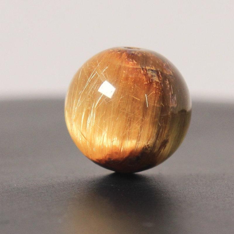 天然石 ゴールドタイチンルチルクォーツ 1粒売り【高品質AAAA 極太金針キャッツアイ】約14ミリ【GHTU25 5g】交換用ゴム付＆巾着1枚 京海堂の画像