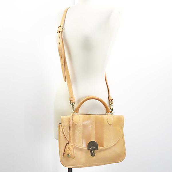 イルビゾンテ ブラウンレザー ハンドバッグ ストラップ付き 立体感ある縦型ハンドバッグ。サイドを開閉し、フォルムに変化を出す