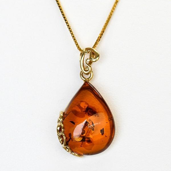 大粒琥珀ペンダントトップ きらきらグリッターきらめく とろりとした