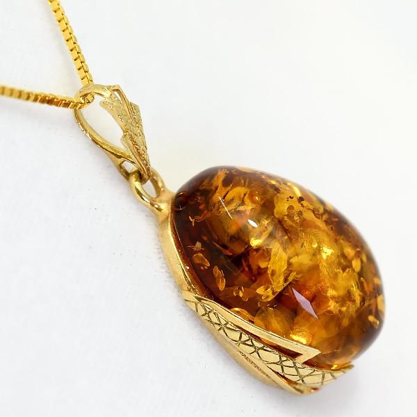 大粒琥珀ペンダントトップ きらきらグリッターきらめく とろりとした