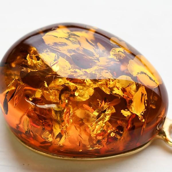 大粒琥珀ペンダントトップ きらきらグリッターきらめく とろりとした