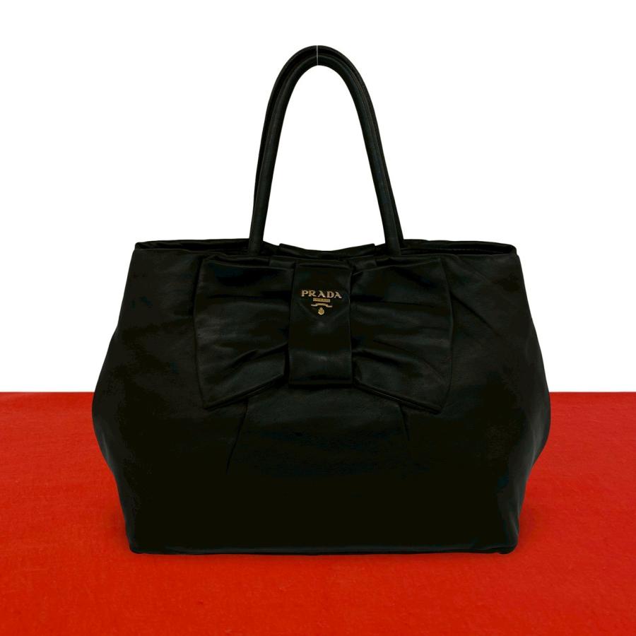 PRADA（プラダ） 極 美品 ロゴ 金具 リボン モチーフ レザー 本革