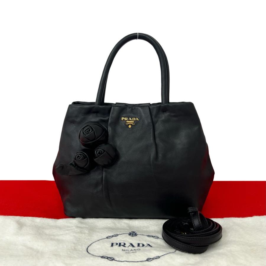 PRADA（プラダ） 極 美品 袋付き ロゴ 金具 ローズ モチーフ レザー 本