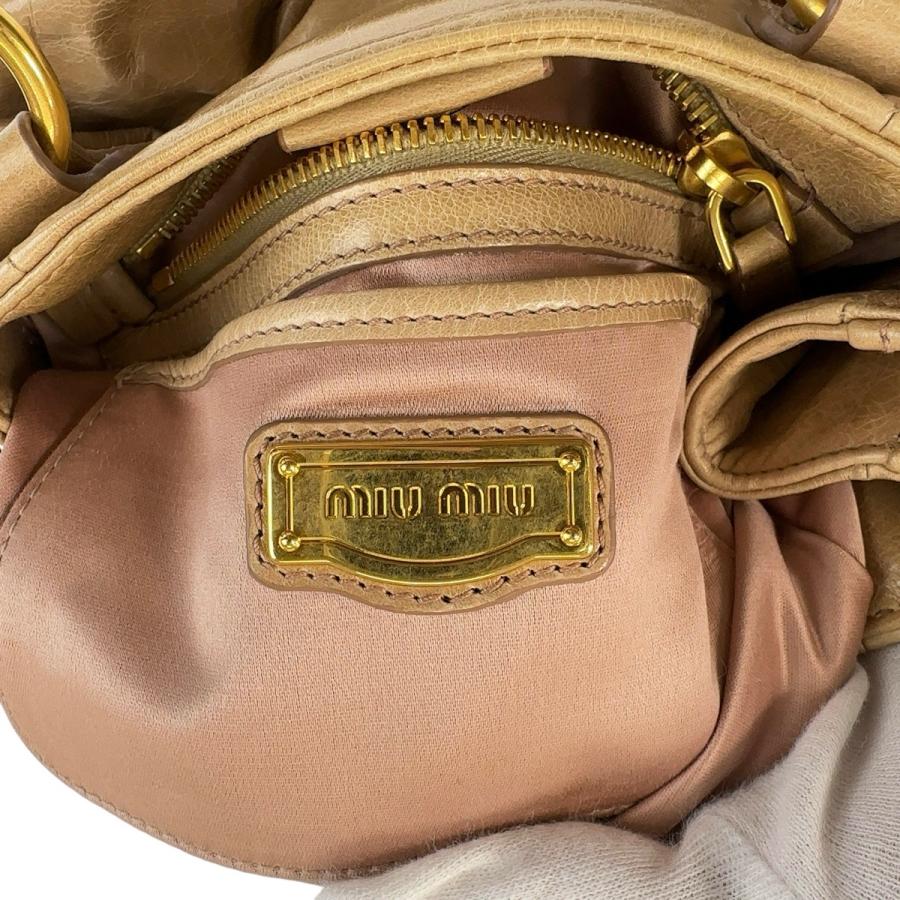 miu miu（ミュウミュウ） 美品 リボン ベージュ ゴールド金具 レザー