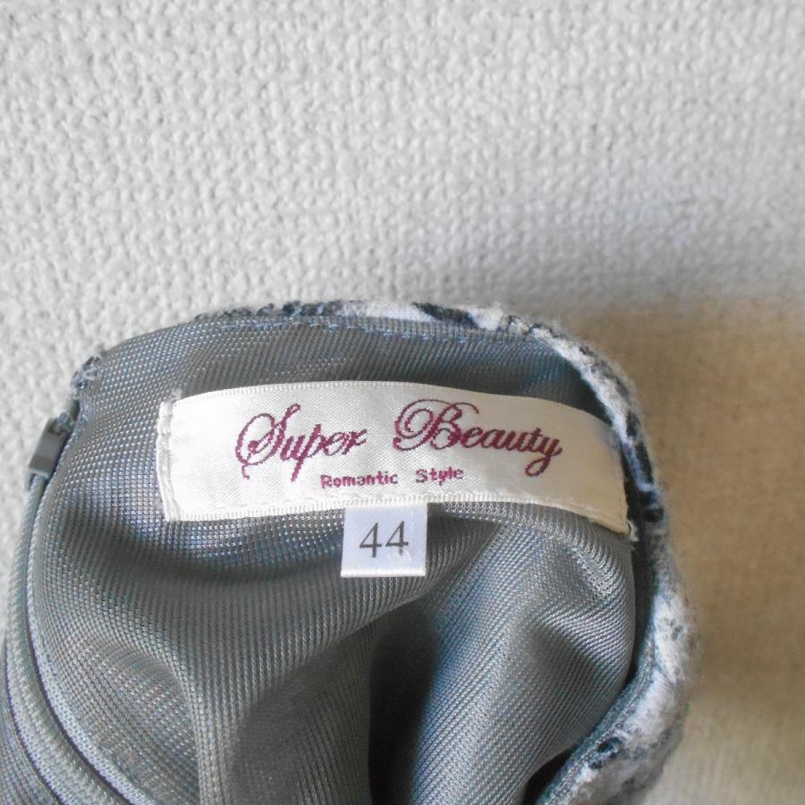 新品】スーパービューティーコサージュ付衿袖先フリルタートルネック