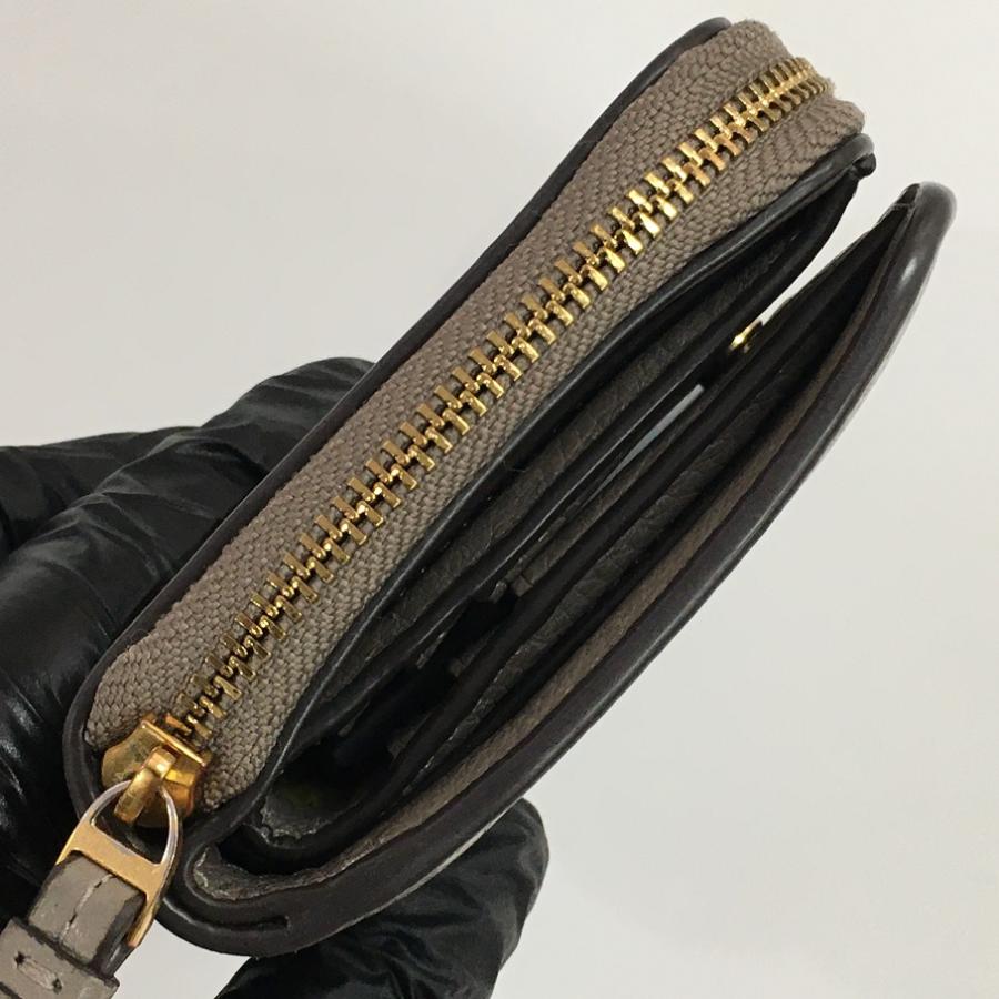 TORY BURCH（トリーバーチ） ティアラウンドファスナーバイフォールド