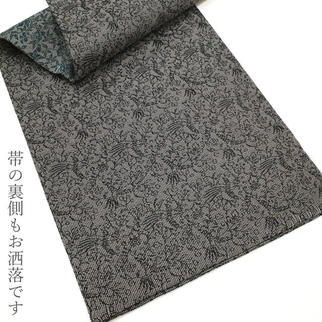 袋帯 未使用 紋屋井関 御寮織 全通 正絹 黒銀地 草花文 深青緑 銀糸 