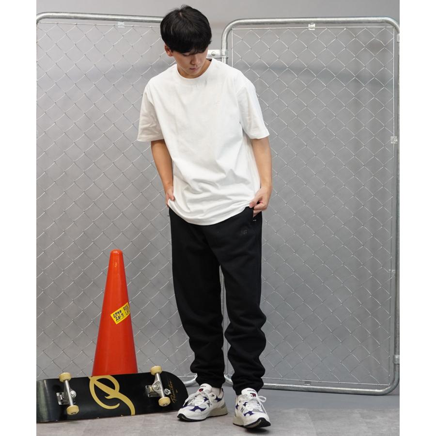 【新品】ニューバランス ／ ロゴ入りパンツ ニューバランス（new balance）（メンズ）Athletics スウェット