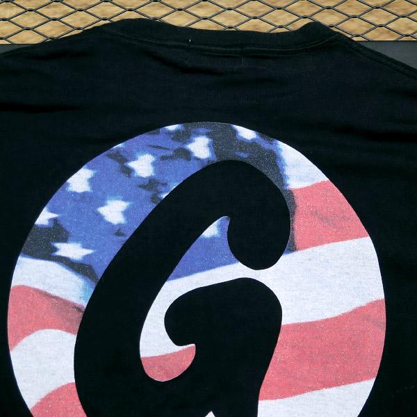 GOODENOUGH（グッドイナフ） GE 星条旗 サークルGプリントTシャツ