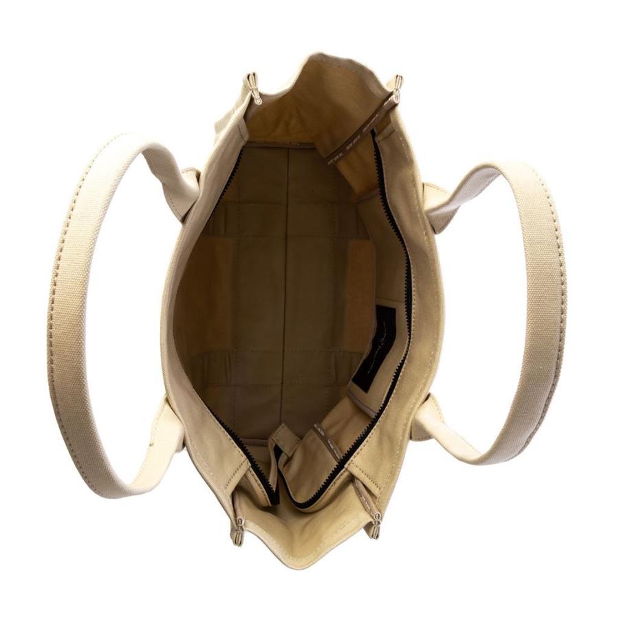 Open beige Marc Jacobs Large Tote Bag showing its spacious interior and pockets.