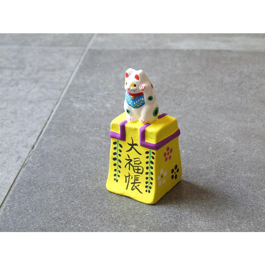 縁起物の置物 郷土玩具 民藝 福島県 工房千想 大福帳乗り猫 黄 縁起物 置物 開運