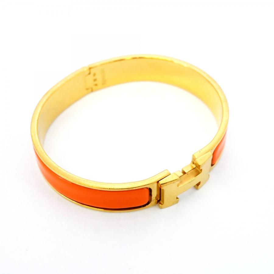 HERMES ゴールドロック付きバングル HERMES ゴールド オレンジ バングル