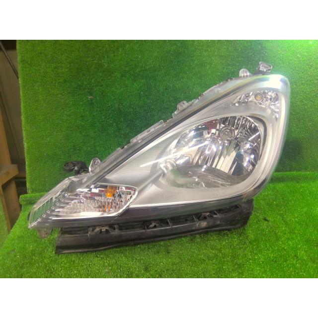 フィット DBA-GE6 左ヘッドランプASSY G 10THアニバーサリー L13A NH624P 33150-TF0-J51の画像