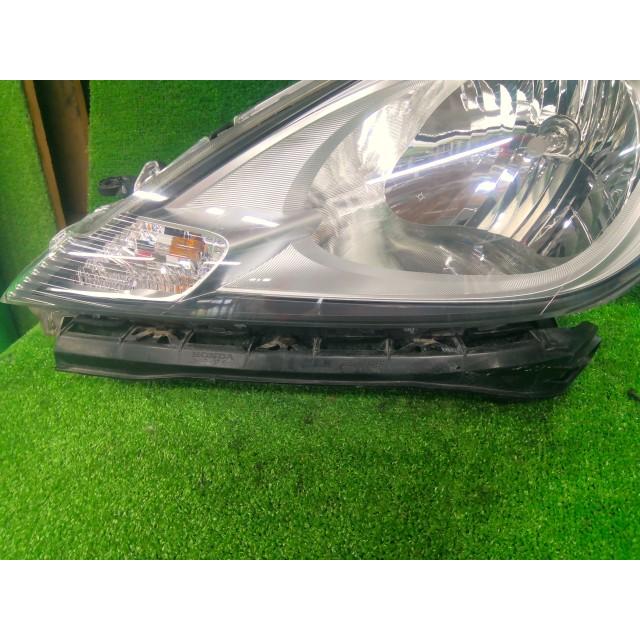 フィット DBA-GE6 左ヘッドランプASSY G 10THアニバーサリー L13A NH624P 33150-TF0-J51の画像