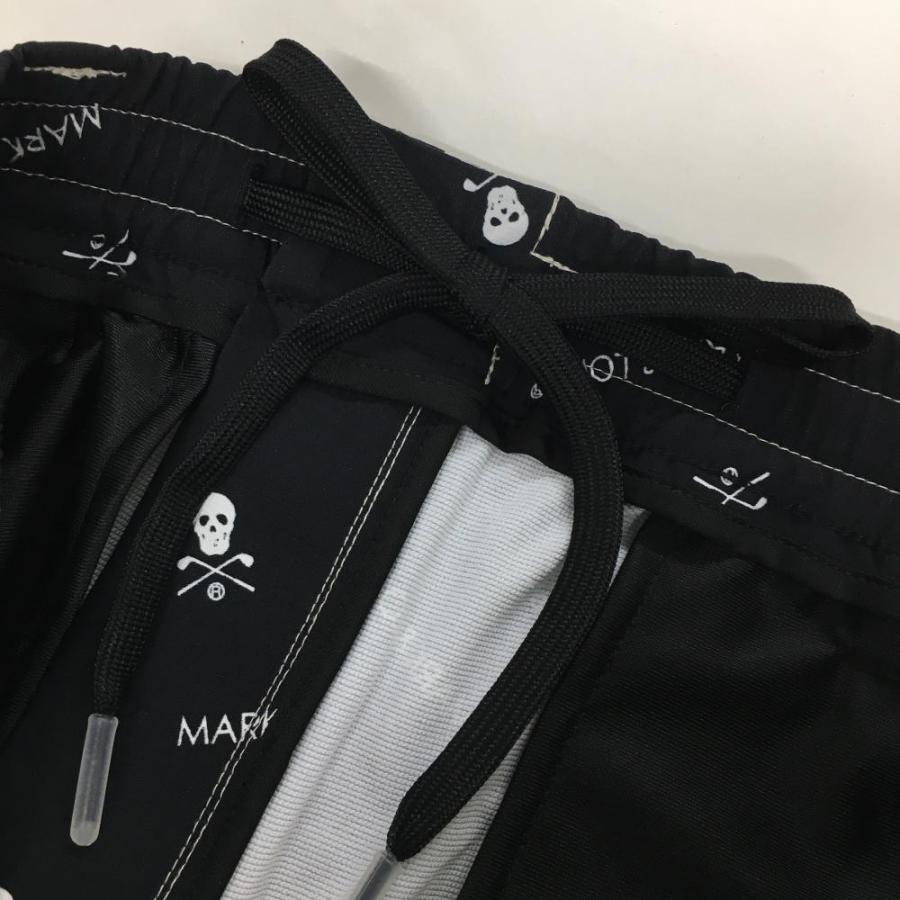 新品】マークアンドロナ パンツ 黒×白 スカル・ロゴ総柄 裾 新品】マークアンドロナ パンツ 黒×白 スカル・ロゴ総柄 裾