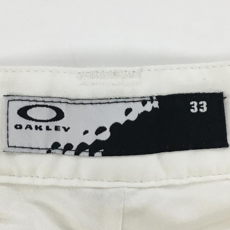 OAKLEY ゴルフ用パンツ 33 ホワイト OAKLEY（オークリー） パンツ 白 ロゴ刺しゅう ティー装着可