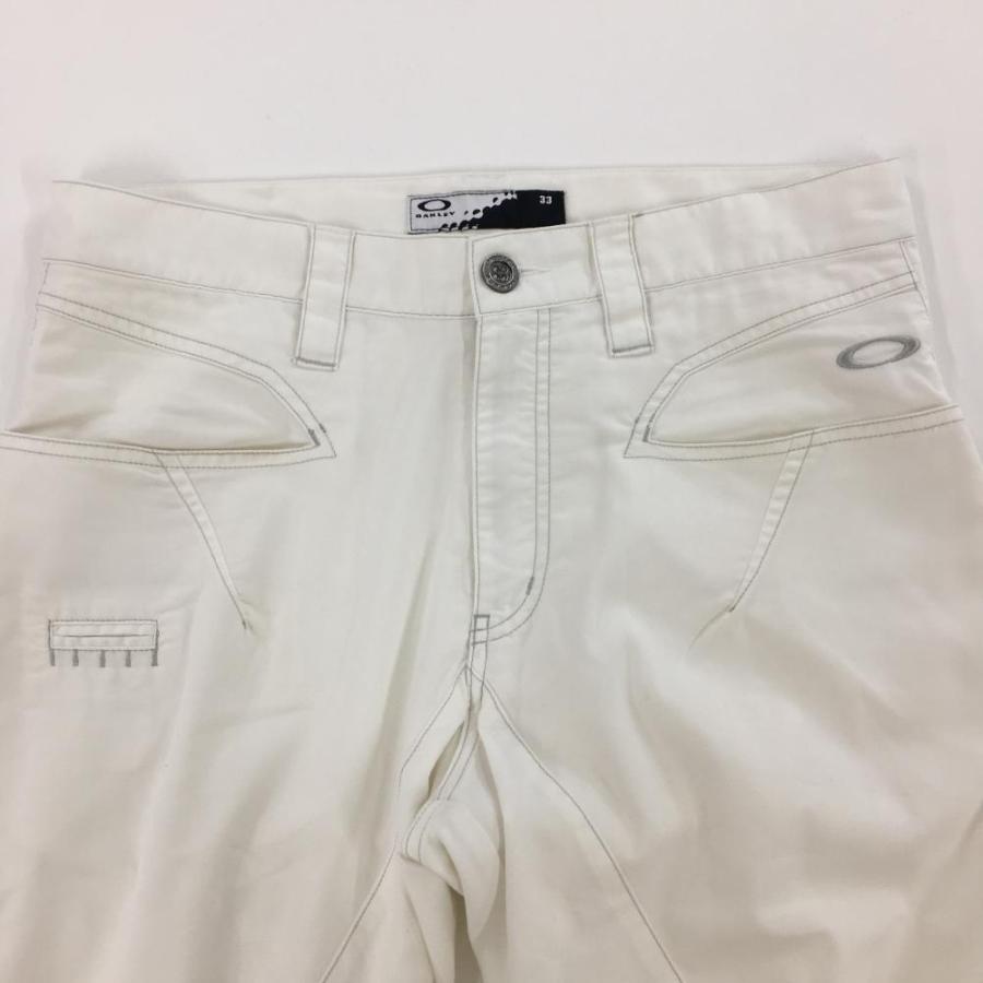 OAKLEY ゴルフ用パンツ 33 ホワイト OAKLEY（オークリー） パンツ 白 ロゴ刺しゅう ティー装着可