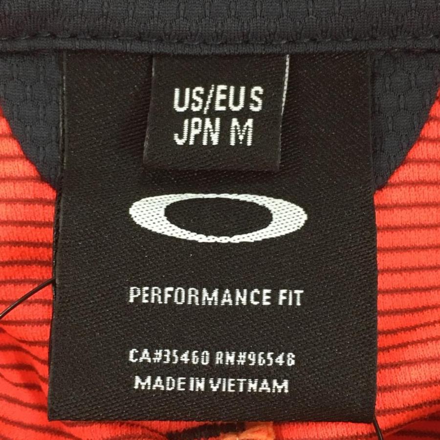 OAKLEY（オークリー） 【新品】オークリー 長袖ポロシャツ 蛍光レッド