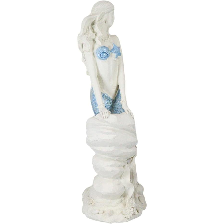 サンゴ礁の岩に座る アクアブルーの尾ヒレを持つ 人魚(マーメイド) 高