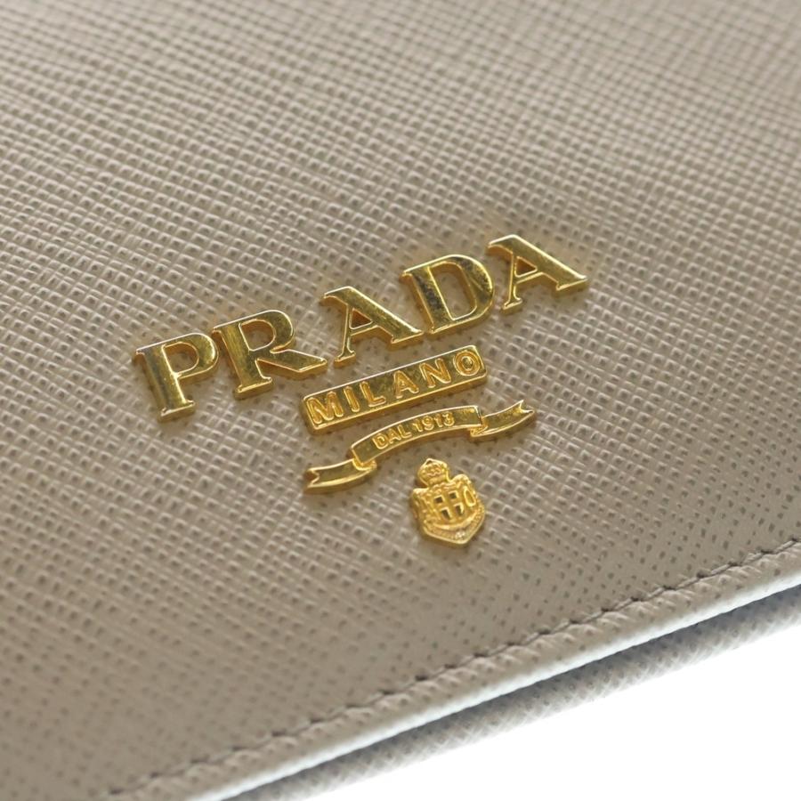 PRADA プラダ　折り財布　リボン　ゴールドロゴ ブルー　サフィアーノレザー PRADA（プラダ） サフィアーノ 二つ折りコンパクトウォレット 財布