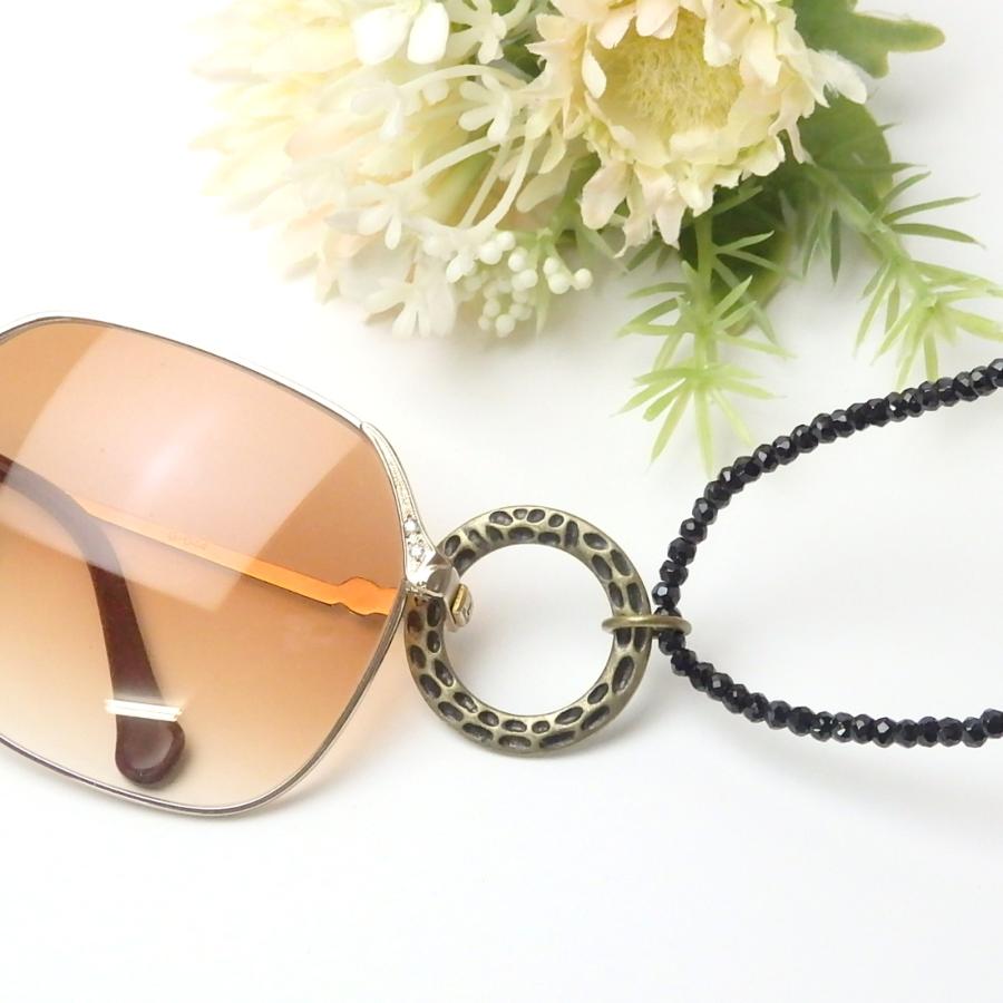 メール便 メガネホルダー グラスホルダー ブラックスピネル 金古美 メタルリング いぶし金 ネックレス サングラスかけ 眼鏡ホルダー メンズ おしゃれ |  | 01