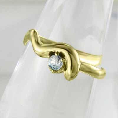 3月の誕生石 一粒石 k18イエローゴールド リング 蛇 アクアマリンの画像