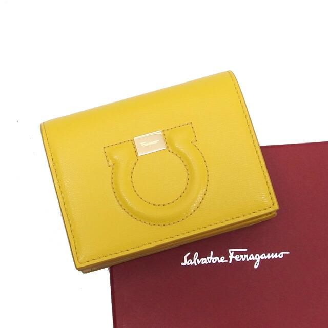 サルヴァトーレ・フェラガモ ガンチーニ 二つ折りコンパクト財布 黄