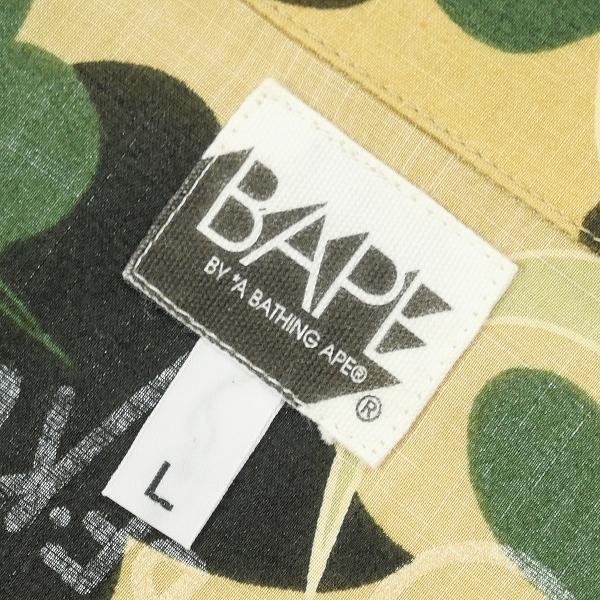 ア ベイシング エイプ A BATHING APE ×KAWS 1stサル迷彩柄半袖シャツ