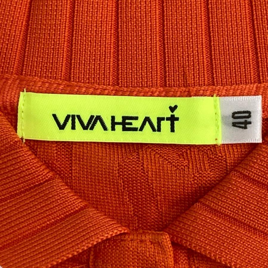 サイズ：40 VIVA HEART ビバハート  半袖ポロシャツ ロゴ総柄 オレンジ系 [240101428826] ゴルフウェア レディース ストスト VIVA HEART ビバハート 半袖ポロシャツ ロゴ総柄 オレンジ系 40