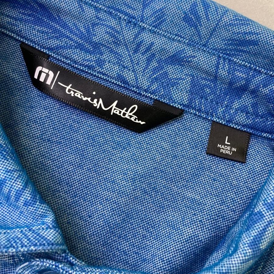 サイズ：L TRAVIS MATHEW トラビスマシュー  半袖ポロシャツ ロゴ刺繍 総柄 ブルー系 [240101474905] ゴルフウェア メンズ ストスト TRAVIS MATHEW トラビスマシュー 半袖ポロシャツ ロゴ刺繍 総柄