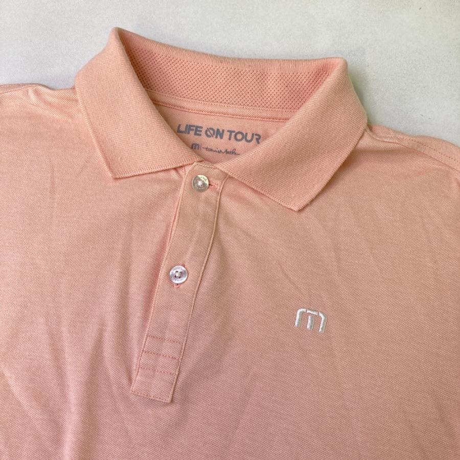 サイズ：M TRAVIS MATHEW トラビスマシュー  半袖ポロシャツ 総柄 ピンク系 [240101475112] ゴルフウェア メンズ ストスト TRAVIS MATHEW トラビスマシュー 半袖ポロシャツ 総柄 ピンク系