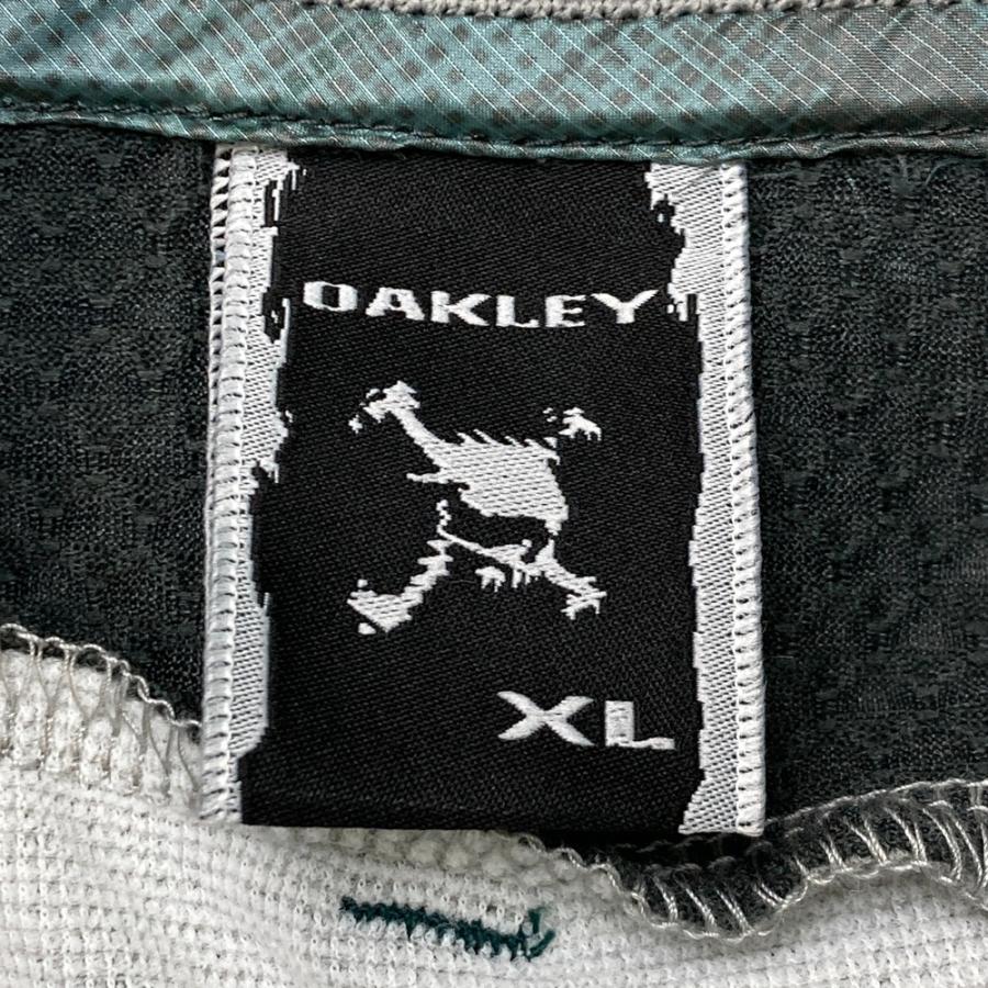 サイズ：XL OAKLEY オークリー  長袖ジップジャケット 迷彩柄 グリーン系 [240101498858] ゴルフウェア メンズ ストスト OAKLEY オークリー 長袖ジップジャケット 迷彩柄 グリーン系 XL