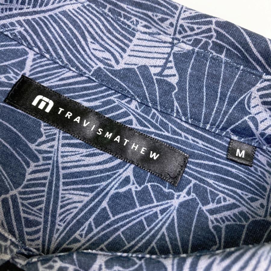 サイズ：M TRAVIS MATHEW トラビスマシュー 7AJ020 半袖ポロシャツ 総柄 ネイビー系 [240101671399] ゴルフウェア メンズ ストスト TRAVISMATHEW トラビスマシュー 7AJ020 半袖ポロシャツ 総柄 ネイビー