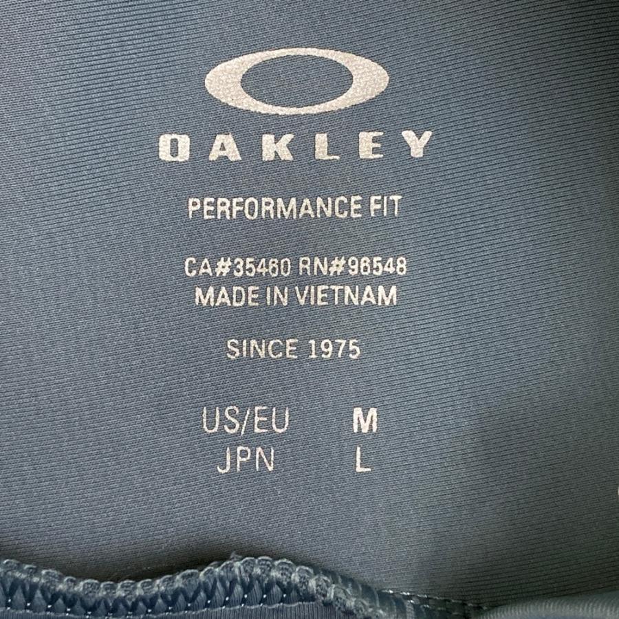 OAKLEY（オークリー） モックネック 長袖Tシャツ スカル刺繍 ブルー系